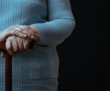 Old person with walking stick